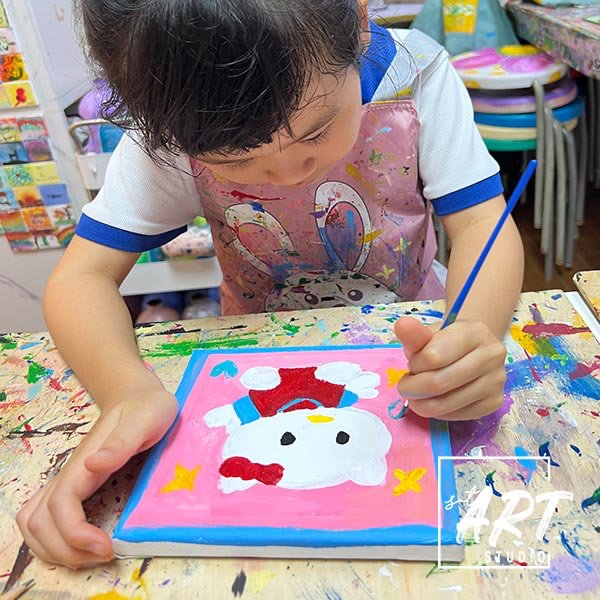 Young artist focused on painting at stART Studio