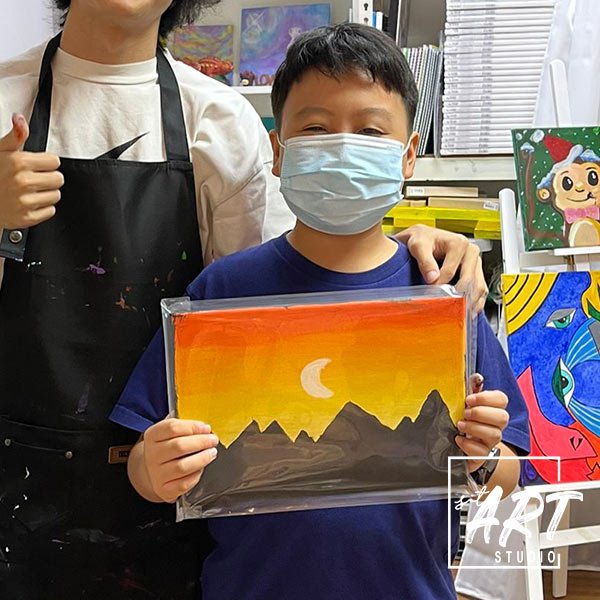 Boy holding sunset mountain landscape painting